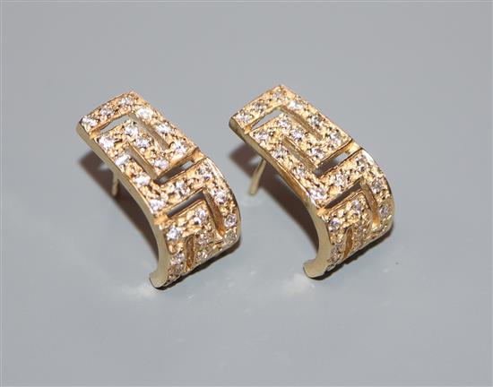 A pair of 585 yellow metal and diamond set curved earrings, 17mm.